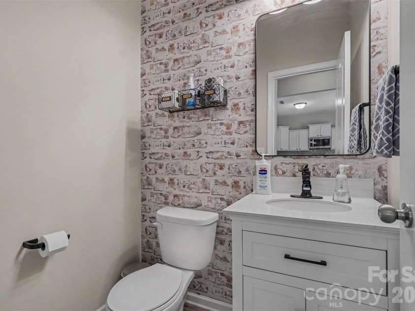 1945 Quill Court, Kannapolis, NC 28083.  MLS# CAR4409683, YatesRealty ID 40927. Powder room on main level