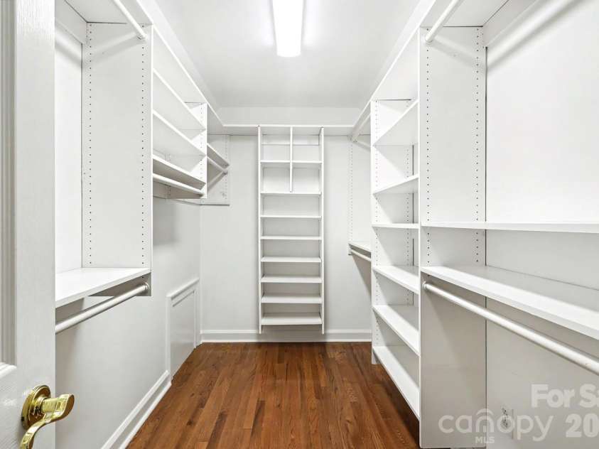 1120 Dilworth Crescent Row, Charlotte, NC 28203.  MLS# CAR4396868, YatesRealty ID 40935. Primary closet with thoughffully designed built ins.