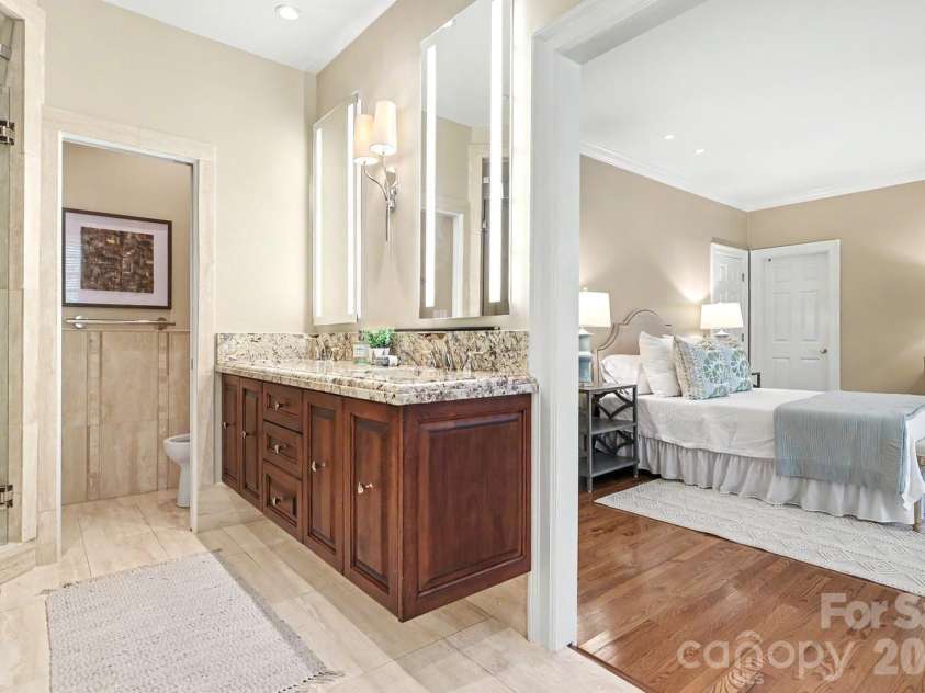 1120 Dilworth Crescent Row, Charlotte, NC 28203.  MLS# CAR4396868, YatesRealty ID 40935. Spacious spa like bath with custom lighting, tile and cabinetry