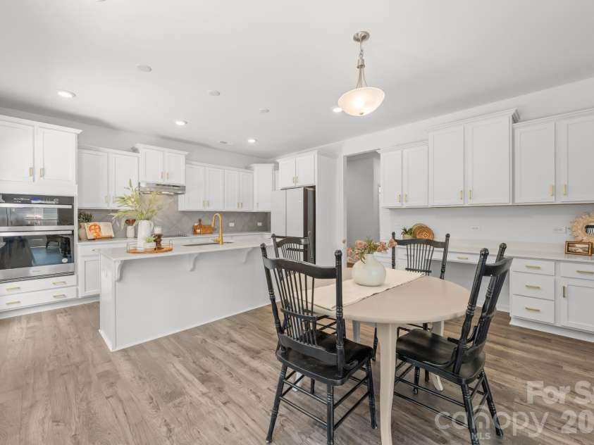 227 Redondo Drive, Wingate, NC 28174.  MLS# CAR4399815, YatesRealty ID 40966. Breakfast area with island and space for bar stools