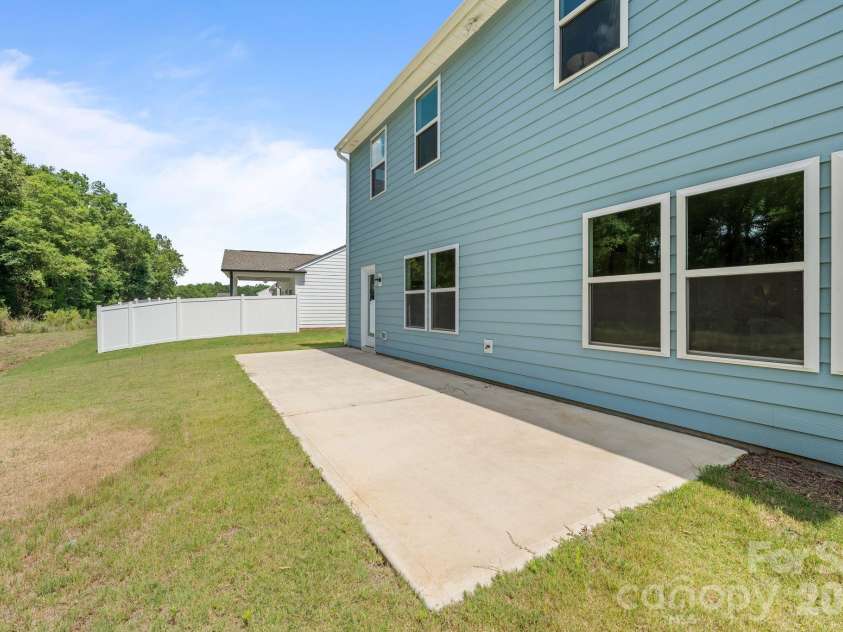 227 Redondo Drive, Wingate, NC 28174.  MLS# CAR4399815, YatesRealty ID 40966. Large concrete pad for entertaining