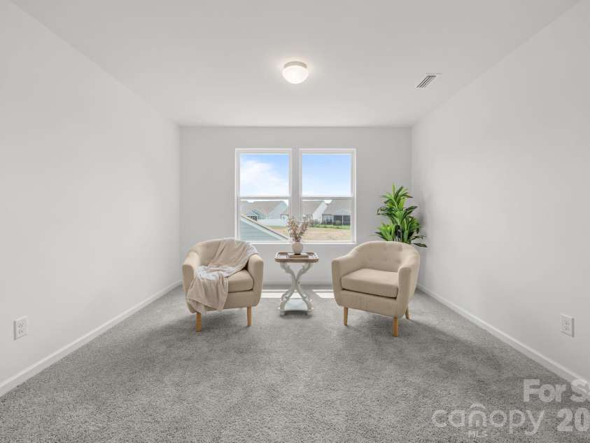 227 Redondo Drive, Wingate, NC 28174.  MLS# CAR4399815, YatesRealty ID 40966. Natural light and sitting area