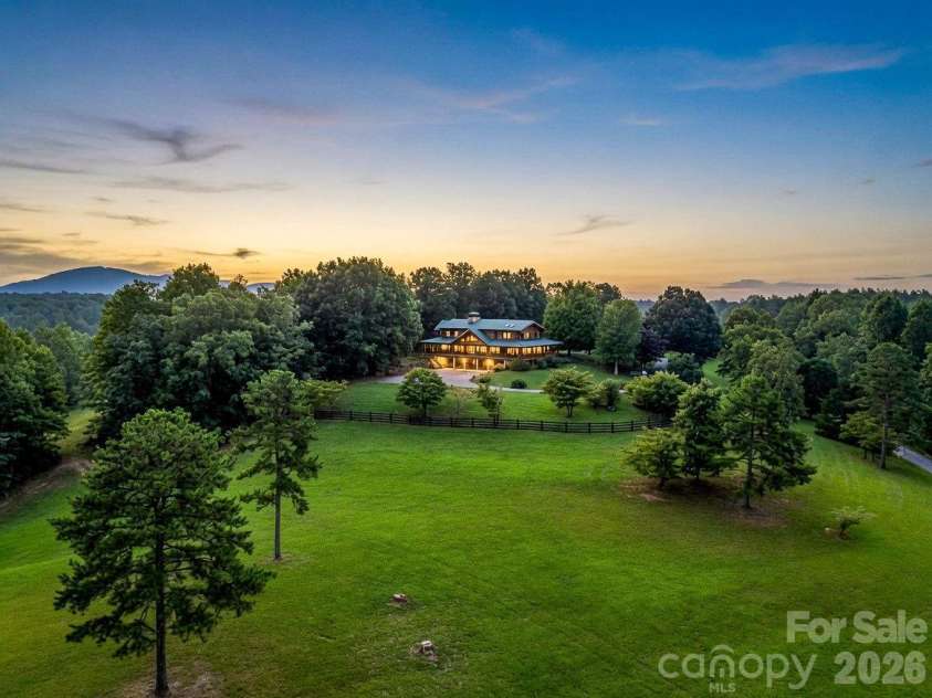 1054 Rainbow Rapids Road, Rutherfordton, NC 28139.  MLS# CAR4408233, YatesRealty ID 40976. Aerial (Twilight Edit)