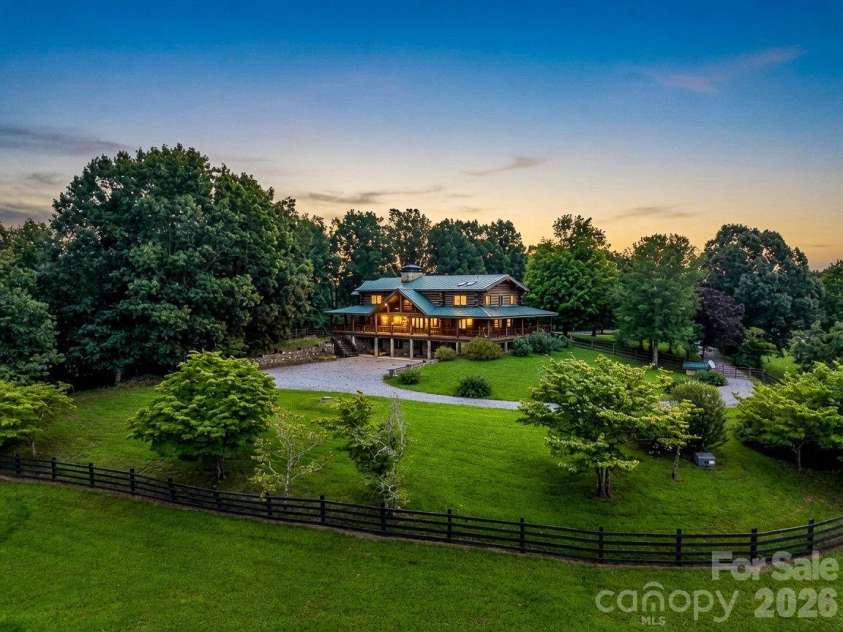 1054 Rainbow Rapids Road, Rutherfordton, NC 28139.  MLS# CAR4408233, YatesRealty ID 40976. Aerial (Twilight Edit)