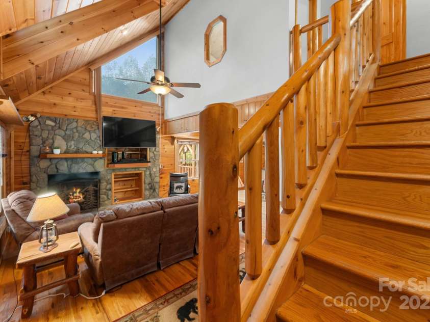 80 Slow Lane, Whittier, NC 28789.  MLS# CAR4307656, YatesRealty ID 4098. Living room from stairs