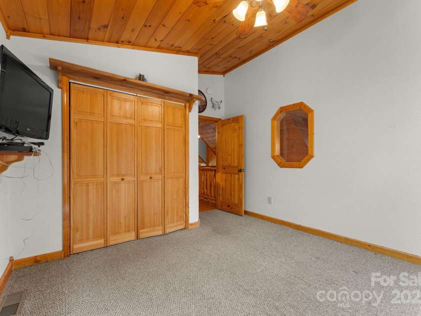80 Slow Lane, Whittier, NC 28789.  MLS# CAR4307656, YatesRealty ID 4098. Upstairs bedroom to the left of stairs