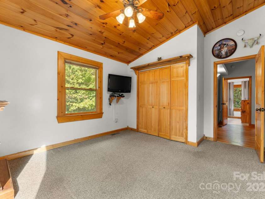 80 Slow Lane, Whittier, NC 28789.  MLS# CAR4307656, YatesRealty ID 4098. Upstairs bedroom to the left of stairs