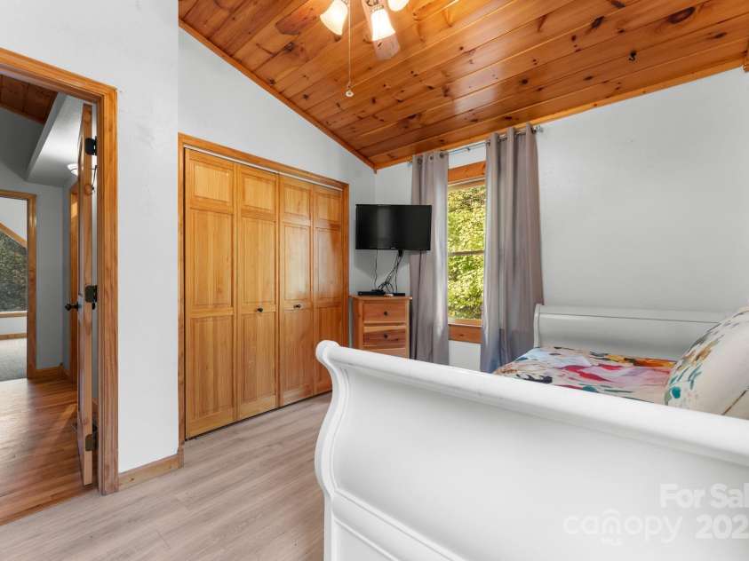 80 Slow Lane, Whittier, NC 28789.  MLS# CAR4307656, YatesRealty ID 4098. Upstairs bedroom to the right of stairs