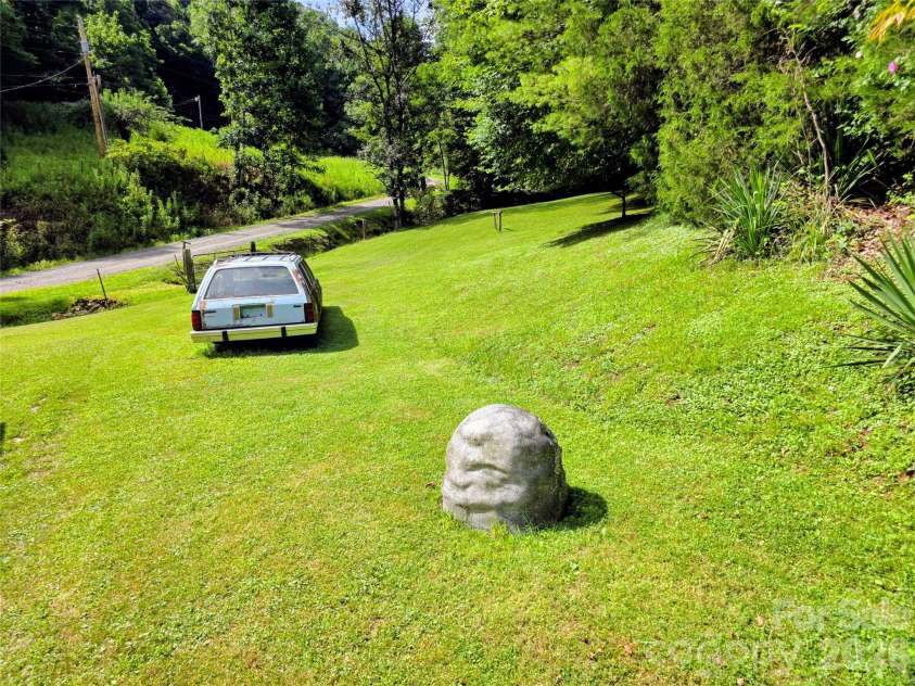 98 Will Wilson Road, Burnsville, NC 28714.  MLS# CAR4406870, YatesRealty ID 40987. Lawn with well