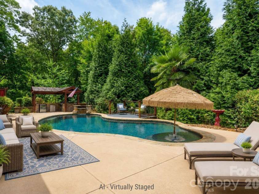 589 Shepherd Road, Troutman, NC 28166.  MLS# CAR4405314, YatesRealty ID 40988. Backyard patio and pool - virtually staged