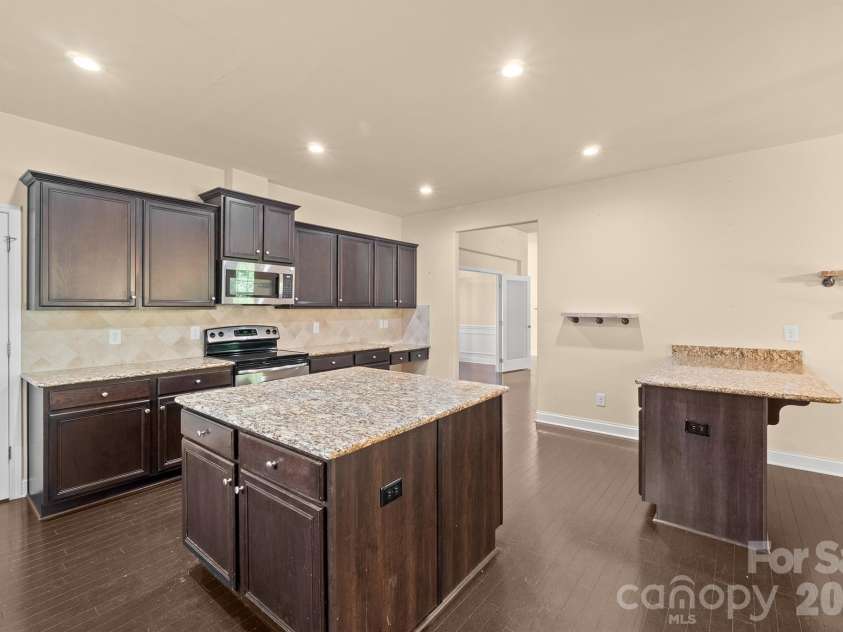 589 Shepherd Road, Troutman, NC 28166.  MLS# CAR4405314, YatesRealty ID 40988. Kitchen w/island and breakfast bar