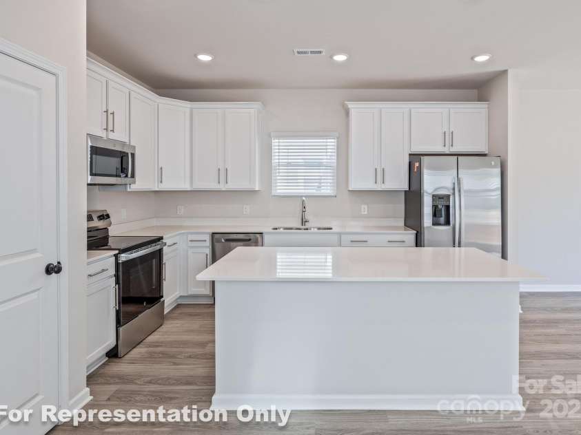 166 Sycamore Street, Mooresville, NC 28115.  MLS# CAR4231441, YatesRealty ID 4101. Gourmet Kitchen w/Eat-At Breakfast Island