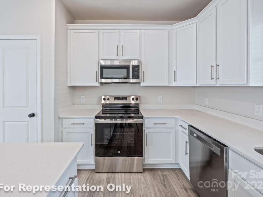 166 Sycamore Street, Mooresville, NC 28115.  MLS# CAR4231441, YatesRealty ID 4101. Kitchen w/Quartz Counters