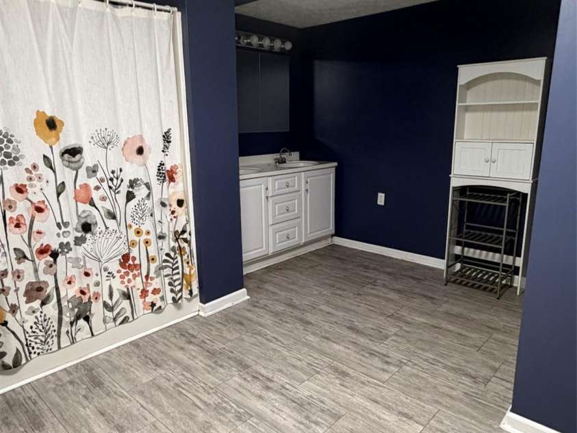 80 Hidden Bluff Lane, Horse Shoe, NC 28742.  MLS# CAR4409946, YatesRealty ID 41012. Bathroom on Main level. Double sink.