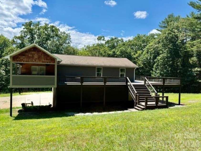 80 Hidden Bluff Lane, Horse Shoe, NC 28742.  MLS# CAR4409946, YatesRealty ID 41012. Front View with wrap around deck.