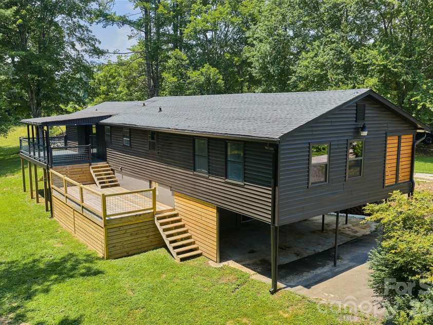 75 Old Macedonia Road, Alexander, NC 28701.  MLS# CAR4408770, YatesRealty ID 41014. A sunny back deck, plus covered porch and level grassy yard space