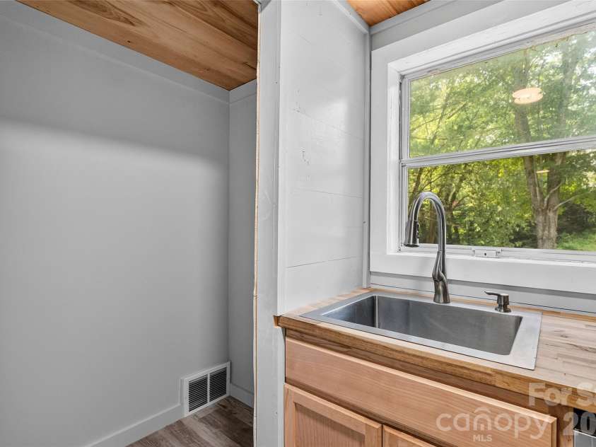 75 Old Macedonia Road, Alexander, NC 28701.  MLS# CAR4408770, YatesRealty ID 41014. Kitchen sink and pantry