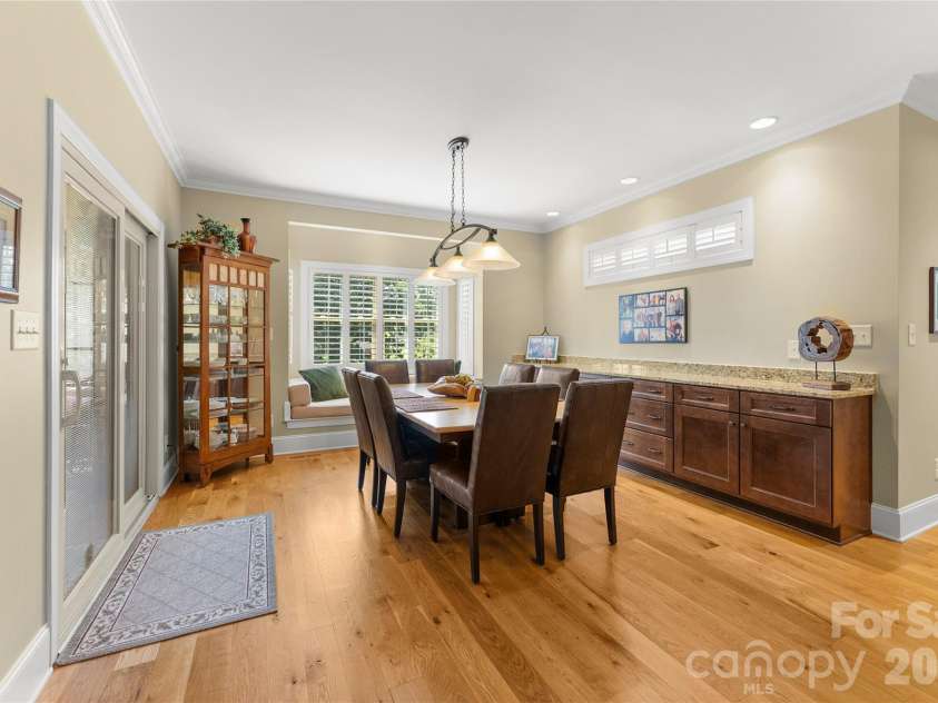 2551 Eagle Drive, Conover, NC 28613.  MLS# CAR4408990, YatesRealty ID 41030. Dining with custom buffet for entertainment storage
