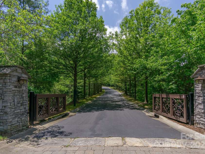 99999 Mills River Way, Horse Shoe, NC 28742.  MLS# CAR4224769, YatesRealty ID 4104. Main gate