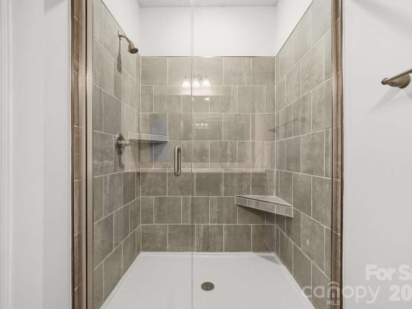 5114 Orchardview Way, Charlotte, NC 28216.  MLS# CAR4335284, YatesRealty ID 4106. Primary Bathroom Tile Shower