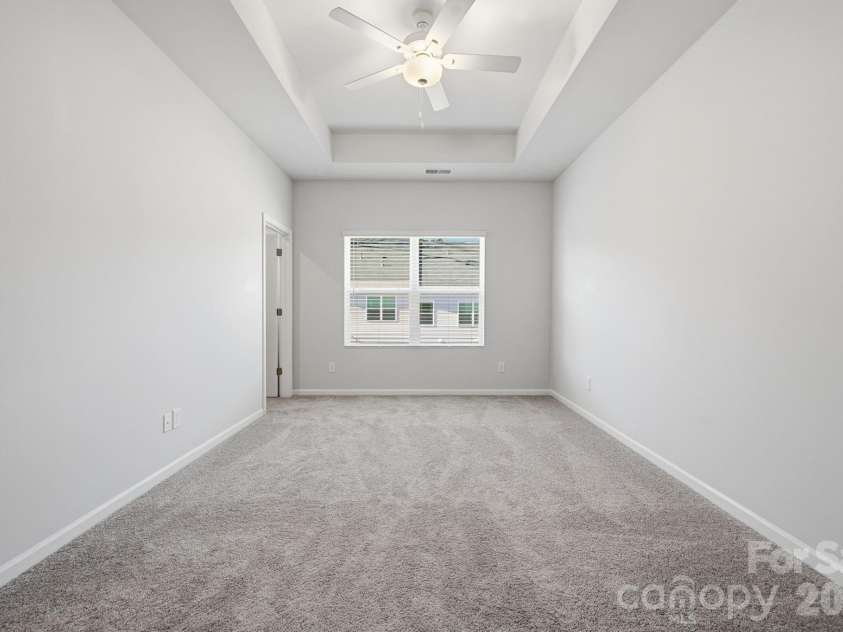 5114 Orchardview Way, Charlotte, NC 28216.  MLS# CAR4335284, YatesRealty ID 4106. Primary Bedroom with 10' tray ceiling