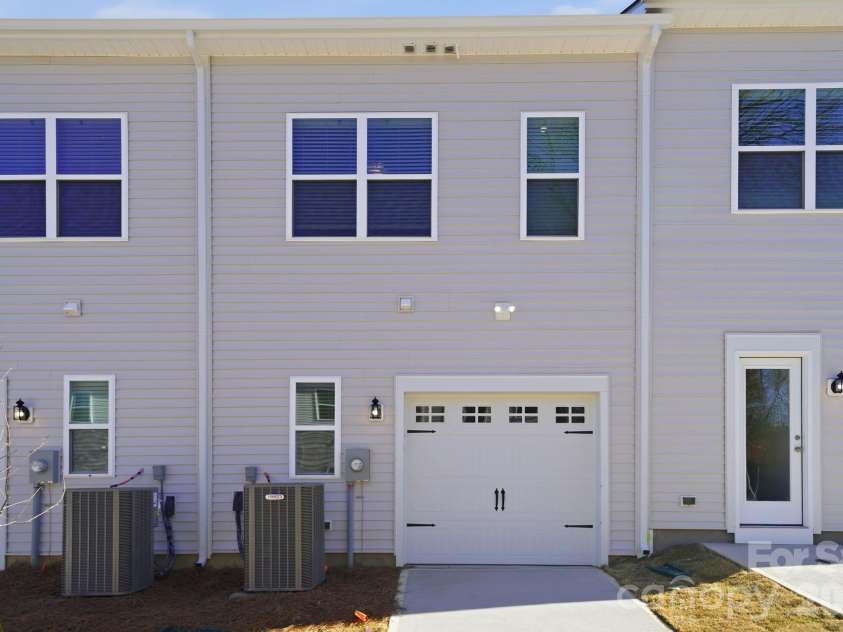 5114 Orchardview Way, Charlotte, NC 28216.  MLS# CAR4335284, YatesRealty ID 4106. Rear Exterior with Garage entry