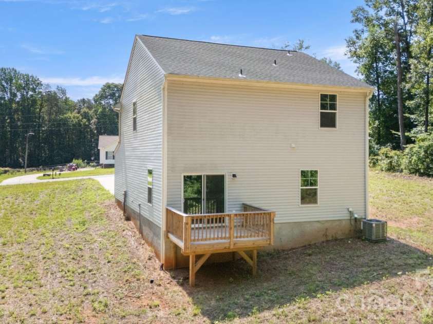 4022 Rolling Creek Road, Vale, NC 28168.  MLS# CAR4390215, YatesRealty ID 41072. Back of house with deck