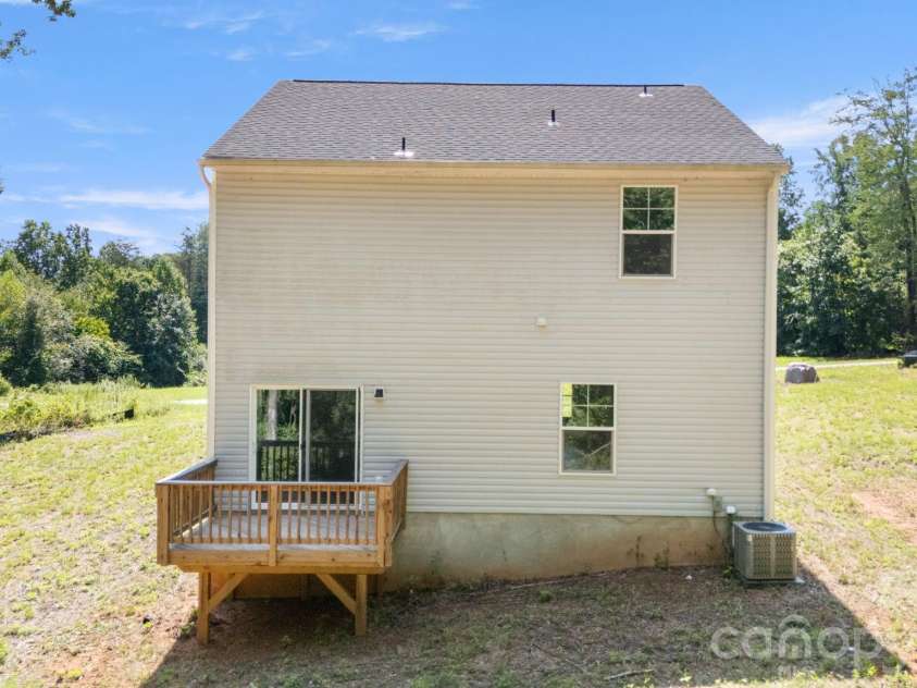 4022 Rolling Creek Road, Vale, NC 28168.  MLS# CAR4390215, YatesRealty ID 41072. Back of house with deck