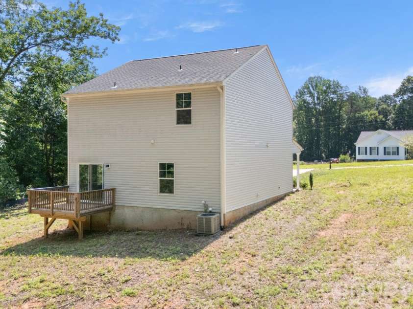 4022 Rolling Creek Road, Vale, NC 28168.  MLS# CAR4390215, YatesRealty ID 41072. Back of house with deck