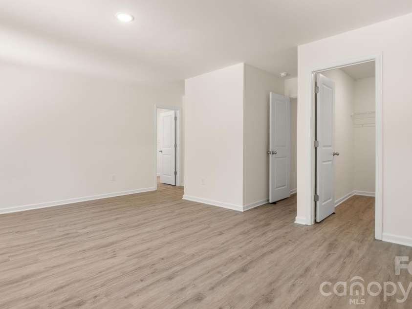 4029 Rolling Creek Drive, Vale, NC 28168.  MLS# CAR4390263, YatesRealty ID 41073. Primary Bedroom with dual walk-in closets.