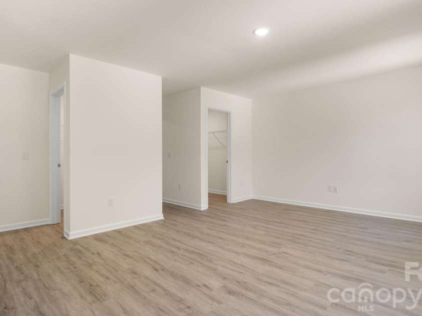 4029 Rolling Creek Drive, Vale, NC 28168.  MLS# CAR4390263, YatesRealty ID 41073. Primary Bedroom with dual walk-in closets.