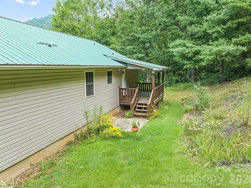 89 Cypress Lane, Canton, NC 28716.  MLS# CAR4399169, YatesRealty ID 41074. Back yard and deck off laundry room