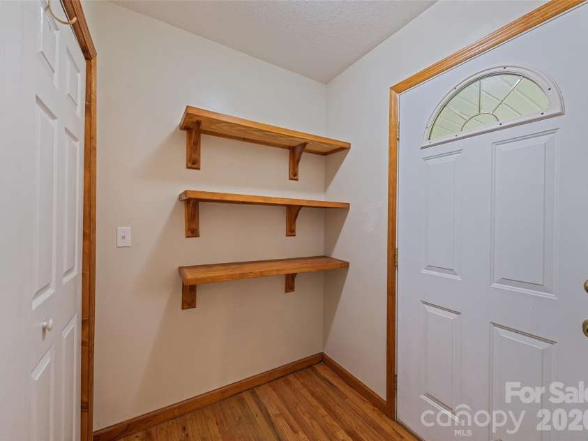 89 Cypress Lane, Canton, NC 28716.  MLS# CAR4399169, YatesRealty ID 41074. Shelving in laundry