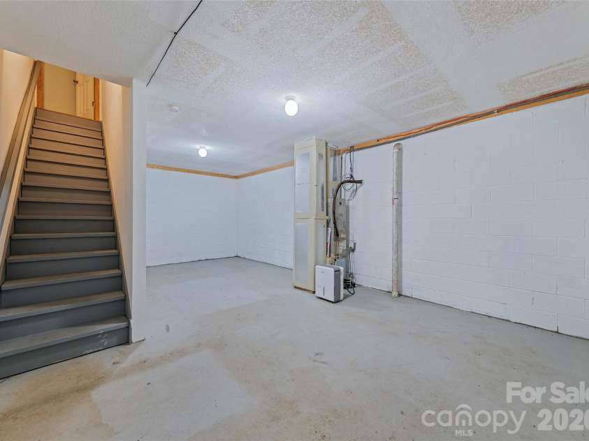 89 Cypress Lane, Canton, NC 28716.  MLS# CAR4399169, YatesRealty ID 41074. Unfinished room in basement