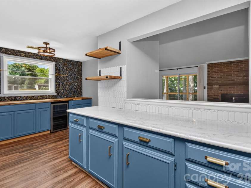 5900 Tillery Drive, Charlotte, NC 28226.  MLS# CAR4406670, YatesRealty ID 41096. Kitchen with window looking into great room