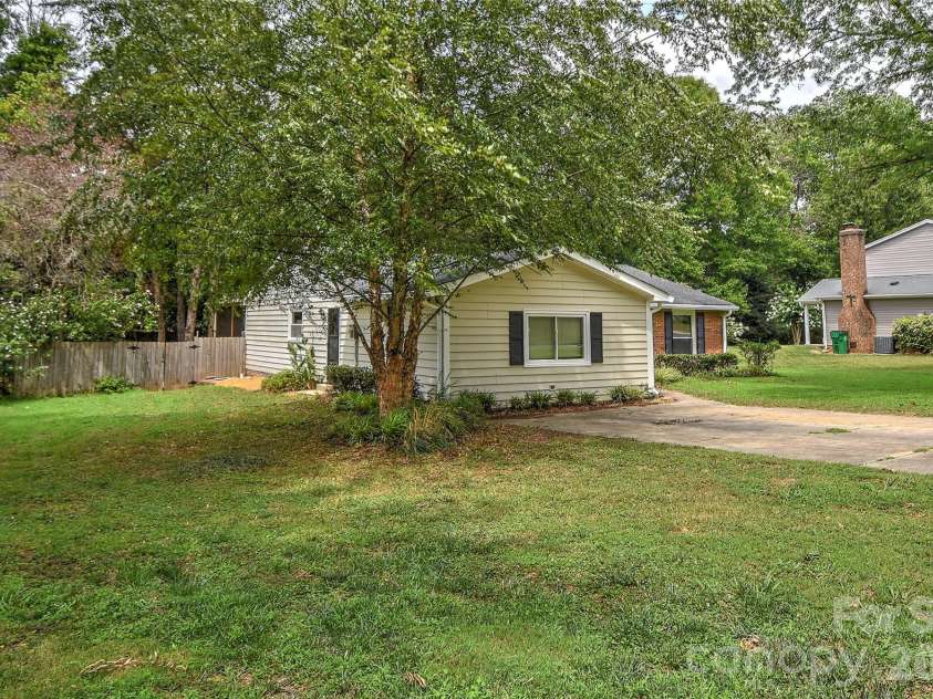 5900 Tillery Drive, Charlotte, NC 28226.  MLS# CAR4406670, YatesRealty ID 41096. Side-front view of home