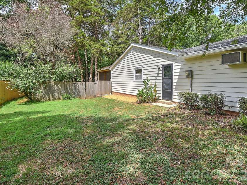 5900 Tillery Drive, Charlotte, NC 28226.  MLS# CAR4406670, YatesRealty ID 41096. Side yard