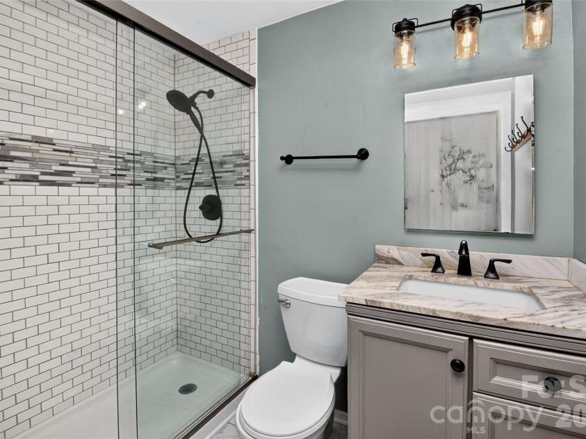 5900 Tillery Drive, Charlotte, NC 28226.  MLS# CAR4406670, YatesRealty ID 41096. Updated primary bathroom with shower