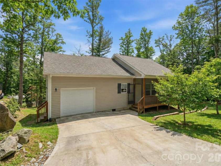 138 Lone Eagle Lane, Hendersonville, NC 28739.  MLS# CAR4342910, YatesRealty ID 4110. Virtually edited to show what it would look like in summer/grass