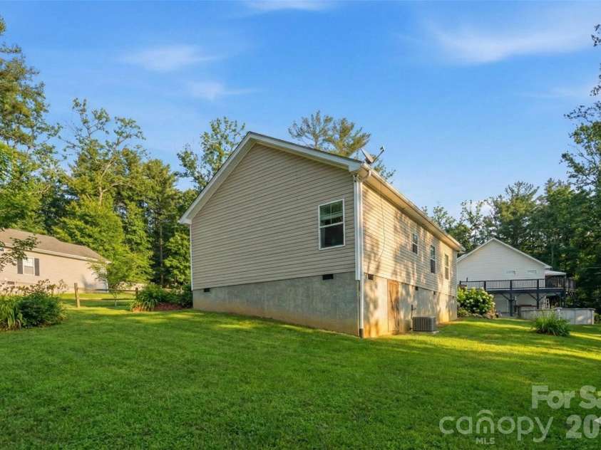 138 Lone Eagle Lane, Hendersonville, NC 28739.  MLS# CAR4342910, YatesRealty ID 4110. Virtually edited to show what it would look like in summer/grass