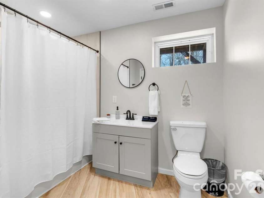 56 Great Horned Owl Road, Candler, NC 28715.  MLS# CAR4381148, YatesRealty ID 41109. Lower level Full bathroom.