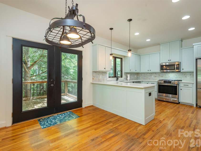 416 Ivy Road, Black Mountain, NC 28711.  MLS# CAR4409427, YatesRealty ID 41112. Large eat it kitchen with a breakfast bar, updated cabinets and counters and quality appliances