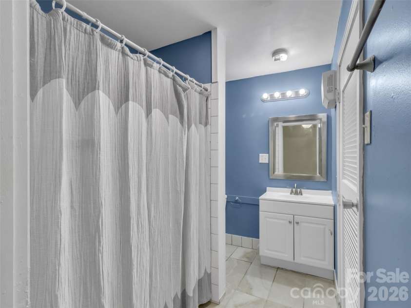 28 Wake Street, Waynesville, NC 28716.  MLS# CAR4402099, YatesRealty ID 41125. Apt #1 bathroom