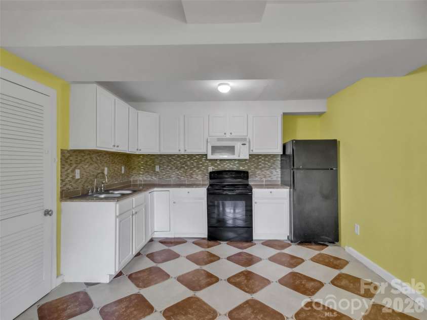 28 Wake Street, Waynesville, NC 28716.  MLS# CAR4402099, YatesRealty ID 41125. Apt #2 kitchen