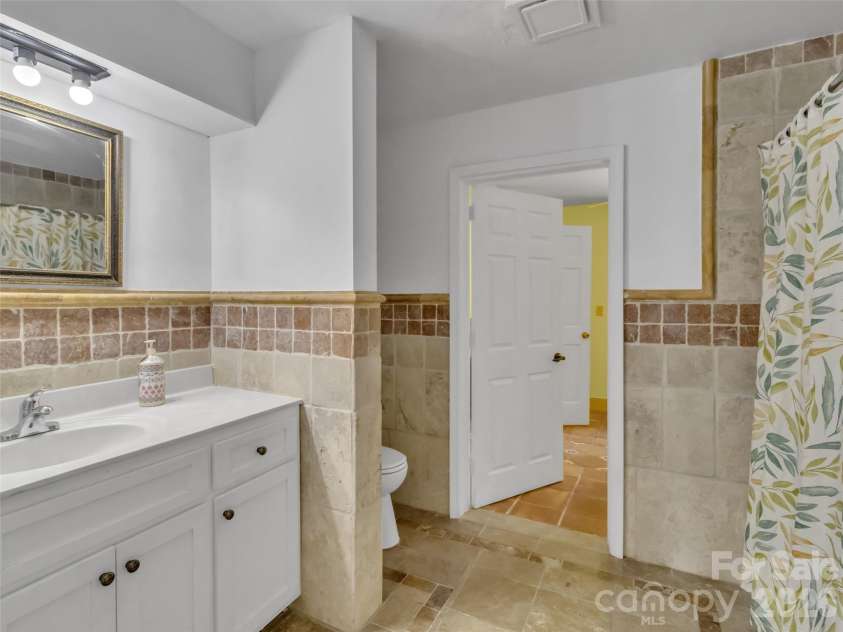 28 Wake Street, Waynesville, NC 28716.  MLS# CAR4402099, YatesRealty ID 41125. Full Bathroom with Laundry room access