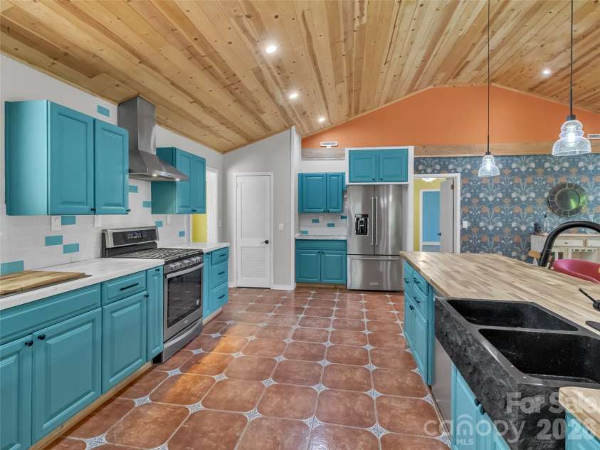 28 Wake Street, Waynesville, NC 28716.  MLS# CAR4402099, YatesRealty ID 41125. Kitchen from dining view