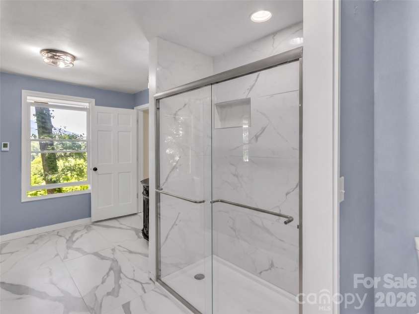 28 Wake Street, Waynesville, NC 28716.  MLS# CAR4402099, YatesRealty ID 41125. Primary Shower