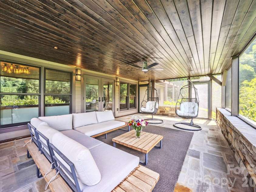 294 Red Knob Lane, Marshall, NC 28753.  MLS# CAR4405147, YatesRealty ID 41131. LOWER LEVEL SCREENED PORCH