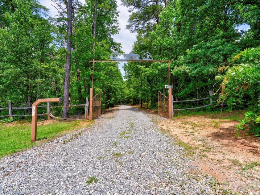 495 Shires Road, Ellenboro, NC 28040.  MLS# CAR4409161, YatesRealty ID 41135. Gate at Entrance