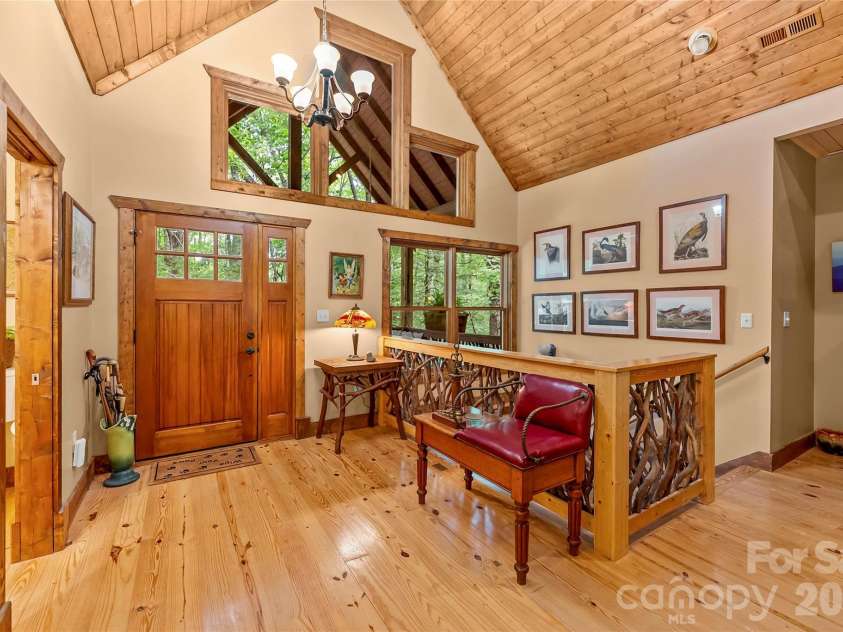 129 Nodatsi Court, Brevard, NC 28712.  MLS# CAR4407587, YatesRealty ID 41149. Continuous wood floors on the main level...